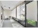 Enclosed patio space with tile flooring and screened windows at 9334 Whitstone Ct, New Port Richey, FL 34655