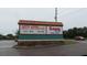 A sign advertising North Trinity Self Storage and Save A Lot food stores at 9334 Whitstone Ct, New Port Richey, FL 34655