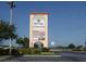 A shopping center sign advertising Sweetbay, various restaurants and healthcare facilities at 9334 Whitstone Ct, New Port Richey, FL 34655