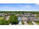 High-angle shot of a quiet residential community with well-kept houses and a wooded backdrop at 9407 Burnam Dr, Weeki Wachee, FL 34613