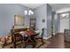 Cozy dining room features a round table with seating, complemented by stylish decor and a modern chandelier at 9407 Burnam Dr, Weeki Wachee, FL 34613