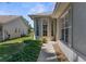 Charming home exterior featuring a rounded bay window, landscaped greenery, and a well-maintained walkway at 9407 Burnam Dr, Weeki Wachee, FL 34613