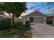 Charming home with a two-car garage, well-maintained lawn, and beautiful landscaping at 9407 Burnam Dr, Weeki Wachee, FL 34613