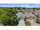 Single-Gathering homes with attached garages and well-kept yards in a community with mature trees and landscaping at 9407 Burnam Dr, Weeki Wachee, FL 34613