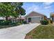 Charming single-story home with manicured landscaping, a two car garage, and a private front entrance at 9407 Burnam Dr, Weeki Wachee, FL 34613