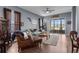 Cozy living room featuring stylish furniture, a ceiling fan, and sliding glass doors leading to the porch at 9407 Burnam Dr, Weeki Wachee, FL 34613