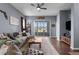 Comfortable living room with a plush sectional sofa, wood floors, and sliding doors to the patio at 9407 Burnam Dr, Weeki Wachee, FL 34613