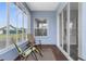 Serene sunroom with multiple windows providing views of the surrounding landscape and a tranquil setting at 9407 Burnam Dr, Weeki Wachee, FL 34613