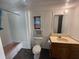Functional bathroom with a single sink vanity, standard toilet, and shower/tub combo at 9444 Loras St, New Port Richey, FL 34654