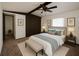 Serene bedroom featuring a queen-sized bed, custom closet, and a peaceful ambiance at 9444 Loras St, New Port Richey, FL 34654