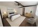 A staged bedroom featuring coordinated furniture, decor, and a comfortable aesthetic at 9444 Loras St, New Port Richey, FL 34654