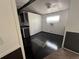 Small kitchenette with dark brown cabinets and black floors, lit by sun coming through a window at 9444 Loras St, New Port Richey, FL 34654