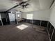 The living room has a ceiling fan, a window, and a partial view of the kitchen at 9444 Loras St, New Port Richey, FL 34654