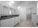 Bright bathroom featuring updated vanity, granite counters, and a glass shower at 9810 San Sebastian Way, Port Richey, FL 34668