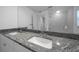 Double vanity with granite counters and stylish sinks in the bathroom at 9810 San Sebastian Way, Port Richey, FL 34668
