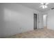 Neutral bedroom with carpet, closet, and adjacent entryways to other spaces at 9810 San Sebastian Way, Port Richey, FL 34668