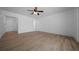 Spacious bedroom with wood floors and neutral paint, offering a blank canvas at 9810 San Sebastian Way, Port Richey, FL 34668