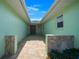 Inviting entryway with stone accents, brick pavers, and a skylight at 9810 San Sebastian Way, Port Richey, FL 34668
