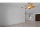 Expansive living space features tile floors and an open view to the kitchen at 9810 San Sebastian Way, Port Richey, FL 34668