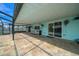 Large partially covered patio, with serving counter, adjacent to the screened pool at 9810 San Sebastian Way, Port Richey, FL 34668