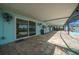 Wide covered lanai with a serving counter leads to the pool at 9810 San Sebastian Way, Port Richey, FL 34668