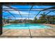 An open view of the enclosed pool and patio at 9810 San Sebastian Way, Port Richey, FL 34668