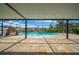 Beautiful screened pool area features a water slide and brick pavers at 9810 San Sebastian Way, Port Richey, FL 34668