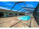 Inviting pool with screened enclosure and a spacious patio area at 9810 San Sebastian Way, Port Richey, FL 34668