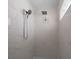 Modern shower featuring dual shower heads, tiled walls, and inset soap holder at 9810 San Sebastian Way, Port Richey, FL 34668