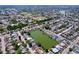 Panoramic aerial view of a residential area next to ponds and lakes, with homes near water at 10111 Glen Moor Ln, Port Richey, FL 34668