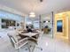 Dining space featuring a round table with chairs and decorative mirrored accents at 10111 Glen Moor Ln, Port Richey, FL 34668