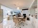 The dining area features a round table, four chairs, and decorative wall accents at 10111 Glen Moor Ln, Port Richey, FL 34668