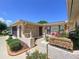 Inviting front porch with decorative plants, statues, and charming accents, enhancing the home's curb appeal at 10111 Glen Moor Ln, Port Richey, FL 34668