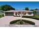 Charming single-story home featuring a well-manicured front yard and attached two-car garage at 10111 Glen Moor Ln, Port Richey, FL 34668