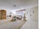 Inviting living room with neutral carpet, comfortable seating, and natural light, creating a cozy atmosphere at 10111 Glen Moor Ln, Port Richey, FL 34668