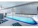 Relaxing screened-in pool area featuring comfortable seating and a refreshing pool at 10111 Glen Moor Ln, Port Richey, FL 34668