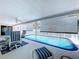 Inviting enclosed pool with clear blue water and surrounding patio space, perfect for outdoor enjoyment at 10111 Glen Moor Ln, Port Richey, FL 34668
