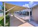 Enclosed pool area with patio, promising a relaxing outdoor experience with ample sunlight at 10111 Glen Moor Ln, Port Richey, FL 34668