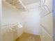 Organized walk-in closet with clothing racks and shelves offering plenty of storage space at 10111 Glen Moor Ln, Port Richey, FL 34668
