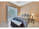 This bedroom is well-lit with neutral tones and plenty of natural light at 10155 Duffy Cir, Weeki Wachee, FL 34613