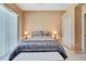 Cozy bedroom featuring neutral color scheme, side tables and bright lighting at 10155 Duffy Cir, Weeki Wachee, FL 34613