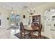 Bright dining room featuring a chandelier and access to the pool area at 10155 Duffy Cir, Weeki Wachee, FL 34613