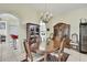 Dining room showcasing a wooden table, chandelier, and elegant china cabinets at 10155 Duffy Cir, Weeki Wachee, FL 34613