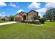 Charming single-story home with well-manicured lawn, mature trees, and a classic two-car garage at 10155 Duffy Cir, Weeki Wachee, FL 34613