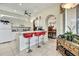 Spacious kitchen featuring bar seating, white cabinets, and modern appliances at 10155 Duffy Cir, Weeki Wachee, FL 34613
