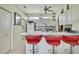 Bright kitchen with white cabinetry, bar seating, and modern appliances at 10155 Duffy Cir, Weeki Wachee, FL 34613