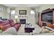 Inviting living room with a cozy fireplace and large entertainment center at 10155 Duffy Cir, Weeki Wachee, FL 34613