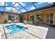 Beautiful backyard pool with brick patio, screened enclosure and outdoor seating area at 10155 Duffy Cir, Weeki Wachee, FL 34613