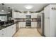 Well-equipped kitchen with stainless steel appliances, plenty of storage, and modern finishes at 10301 Nina Ct, New Port Richey, FL 34654