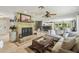 Spacious living room featuring tiled floors, fireplace, and open floorplan at 10301 Nina Ct, New Port Richey, FL 34654